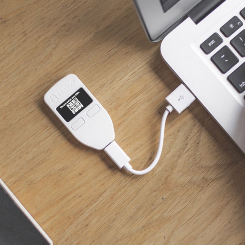 Trezor One connected to a laptop. Source Hardware Wallet Online